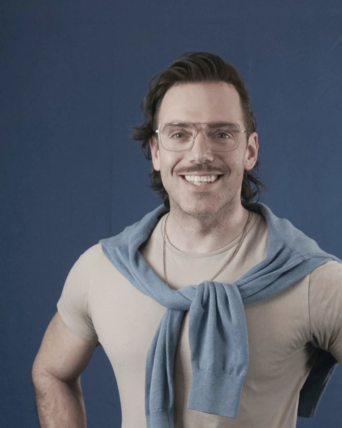 Don-E Coady — the real photograph, hands on hips, smiling